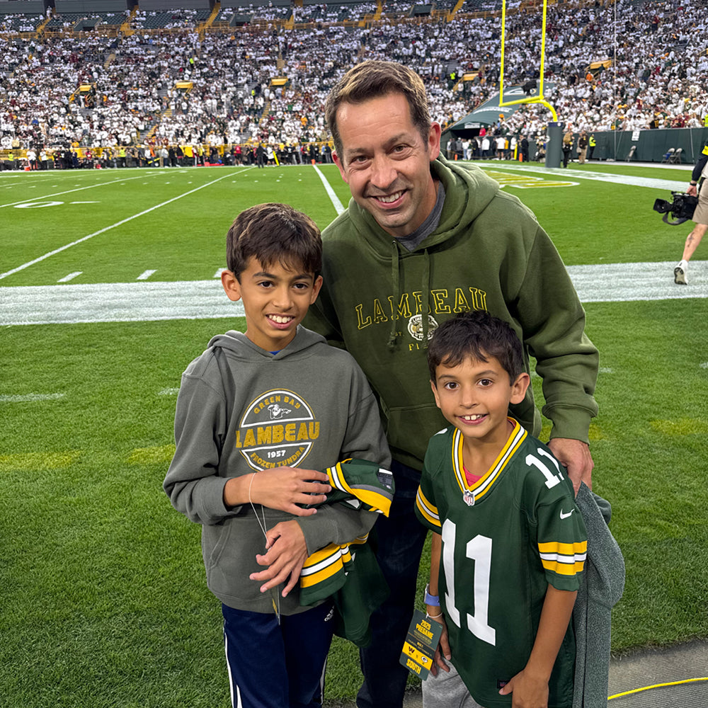 Chad Kase with his sons at Lambeau Field.
